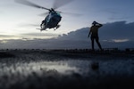 A U.S. Sailor assigned to the San Antonio-class amphibious transport dock USS Fort Lauderdale (LPD 28) gives a send-off salute as a U.S. Marine Corps UH-1Y Venom  assigned to Marine Medium Tiltrotor Squadron (VMM) 365 (Reinforced), Littoral Combat Force-24, takes off during night deck landing qualifications while underway in the Caribbean Sea, May 19, 2026. U.S. military forces are deployed to the U.S. Southern Command area of responsibility in support of Operation SOUTHERN SPEAR, Department of War-directed operations, and the president’s priorities to disrupt illicit drug trafficking, deter malign actors and protect the homeland through continuous presence. (U.S. Marine Corps photo)