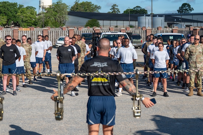 Airmen stand in formation.