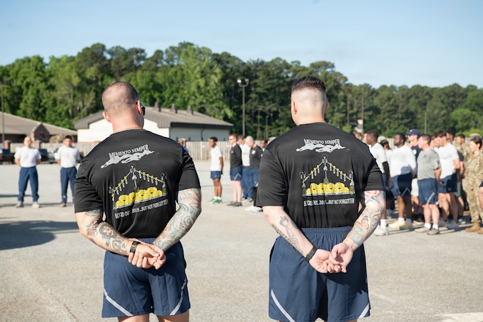 Airmen stand in formation.