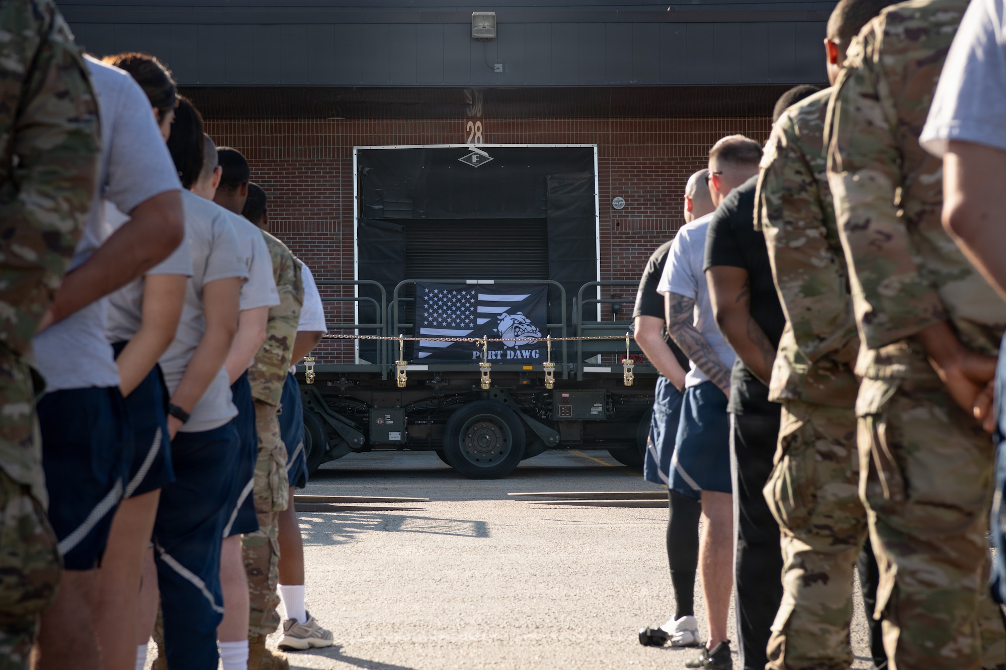 Airmen stand in formation.