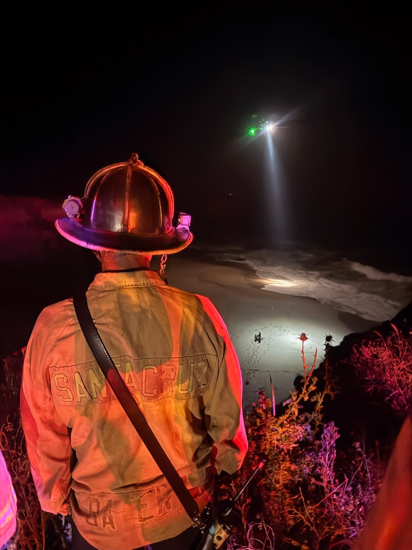 A U.S. Coast Guard Air Station San Francisco MH-65 Dolphin aircrew rescues three people from a cave near Santa Cruz, California, May 17, 2026.  Air crew members hoisted all three individuals and transferred them to the care of nearby CAL FIRE and Santa Cruz County Fire personnel for further evaluation. (U.S. Coast Guard photo by Petty Officer 2nd Class Thomas Sizer)