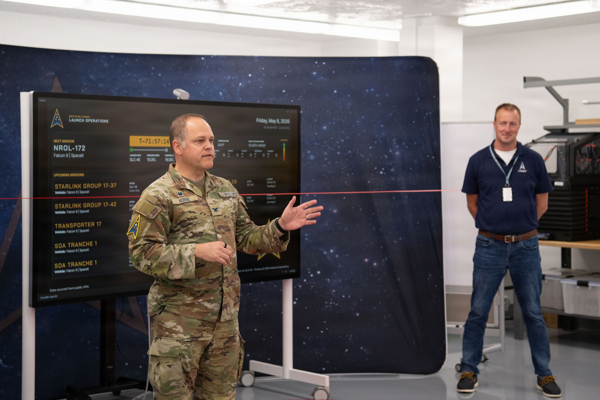 U.S. Space Force Col. James T. Horne III, Space Launch Delta 30 commander cuts a ribbon celebrating a new on-base Vandenberg Launch Dashboard at Vandenberg Space Force Base, Calif., May 8, 2026. The Vandenberg Launch Dashboard was created by SLD 30’s Digital Transformation Office to share upcoming Vandenberg launches with the base population. The dashboard is now active at the Pacific Coast Center for on-base launch schedule awareness. (U.S. Space Force photo by 2nd Lt. Andrew Taller)