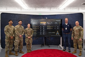 U.S. Space Force Col. James T. Horne III, Space Launch Delta 30 commander cuts a ribbon celebrating a new on-base Vandenberg Launch Dashboard at Vandenberg Space Force Base, Calif., May 8, 2026. The Vandenberg Launch Dashboard was created by SLD 30’s Digital Transformation Office to share upcoming Vandenberg launches with the base population. The dashboard is now active at the Pacific Coast Center for on-base launch schedule awareness. (U.S. Space Force photo by 2nd Lt. Andrew Taller)