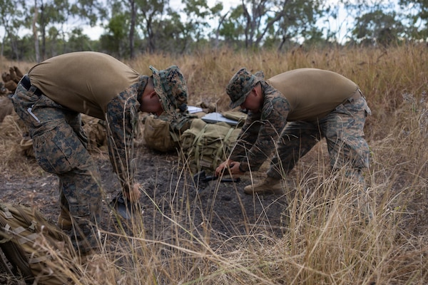U.S. Marines with Alpha Company, 1st Battalion, 5th Marine Regiment, Marine Rotational Force – Darwin 26, clear vegetation at Townsville Field Training Area, Australia, May 26, 2026.