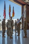 U.S. Army Maj. Gen. David W. Gardner, commander of 101st Airborne Division (Air Assault) and the Joint Task Force-Southern Border (JTF-SB), hands off the JTF-SB colors to Gen. Gregory M. Guillot, commander of U.S. Northern Command (USNORTHCOM), during the transfer of authority ceremony between the 101st Airborne Division (Air Assault) and the 1st Armored Division, at Fort Huachuca, Ariz., May 29, 2026. A transfer of authority ceremony is a ceremonial event that marks the official transition of operational control, responsibilities, and mission authority from an outgoing unit to an incoming unit. U.S. Northern Command is working side-by-side with the Department of Homeland Security and the U.S. Customs and Border Protection within narrowly defined authorities to provide unique military capabilities to protect the territorial integrity of the U.S. southern border.  (Dept. of War photo by Spc. Anthony Opromolla)