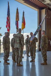 U.S. Army Maj. Gen. David W. Gardner, commander of 101st Airborne Division (Air Assault) and the Joint Task Force-Southern Border (JTF-SB), hands off the JTF-SB colors to Gen. Gregory M. Guillot, commander of U.S. Northern Command (USNORTHCOM), during the transfer of authority ceremony between the 101st Airborne Division (Air Assault) and the 1st Armored Division, at Fort Huachuca, Ariz., May 29, 2026. A transfer of authority ceremony is a ceremonial event that marks the official transition of operational control, responsibilities, and mission authority from an outgoing unit to an incoming unit. U.S. Northern Command is working side-by-side with the Department of Homeland Security and the U.S. Customs and Border Protection within narrowly defined authorities to provide unique military capabilities to protect the territorial integrity of the U.S. southern border.  (Dept. of War photo by Spc. Anthony Opromolla)