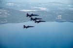 U.S. Air Force T-38 Talons assigned to the 1st Reconnaissance Squadron at Beale Air Force Base, fly in a four-ship formation over Lake Tahoe, California, Jan. 30, 2026. The T-38 is a twin-engine, high-altitude, supersonic jet trainer used in a variety of roles because of its design; economy of operations, ease of maintenance, high performance and exceptional safety record. (U.S. Air Force photo by Senior Airman Chelsea Arana)
