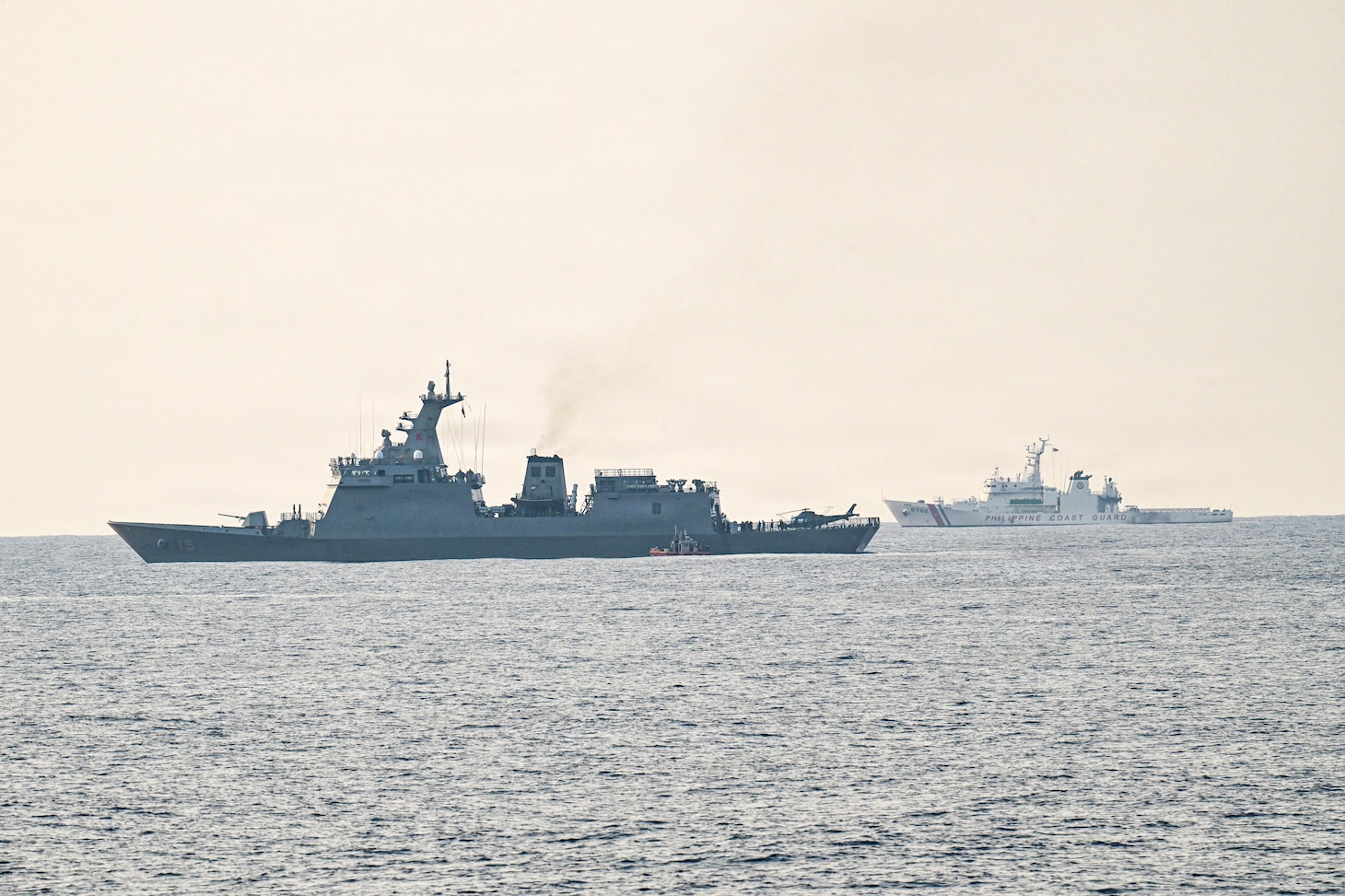 A U.S. Coast Guard 35-foot Long-Range Interceptor embarked cutter boat attached to Legend-class cutter USCGC Midgett (WMSL 757) sails alongside Philippine Navy BRP Antonio Luna (FFG-151) in support of a passenger transfer during the Maritime Cooperative Activity (MCA) in the Philippines’ Exclusive Economic Zone, May 28, 2026. The U.S Navy routinely operates with the Armed Forces of the Philippines and partners and allies through MCAs to continually develop, exercise and enhance multi-domain tactical interoperability to uphold peace and security in the region. Midgett is forward-deployed and assigned to Destroyer Squadron (DESRON) 15, the Navy’s largest DESRON and U.S. 7th Fleet’s principal surface force. U.S. 7th Fleet, the Navy’s largest forward-deployed numbered fleet, routinely interacts and operates with allies and partners in preserving a free and open Indo-Pacific.  (U.S. Coast Guard Photo by Petty Officer 3rd Class Austin Wiley)
