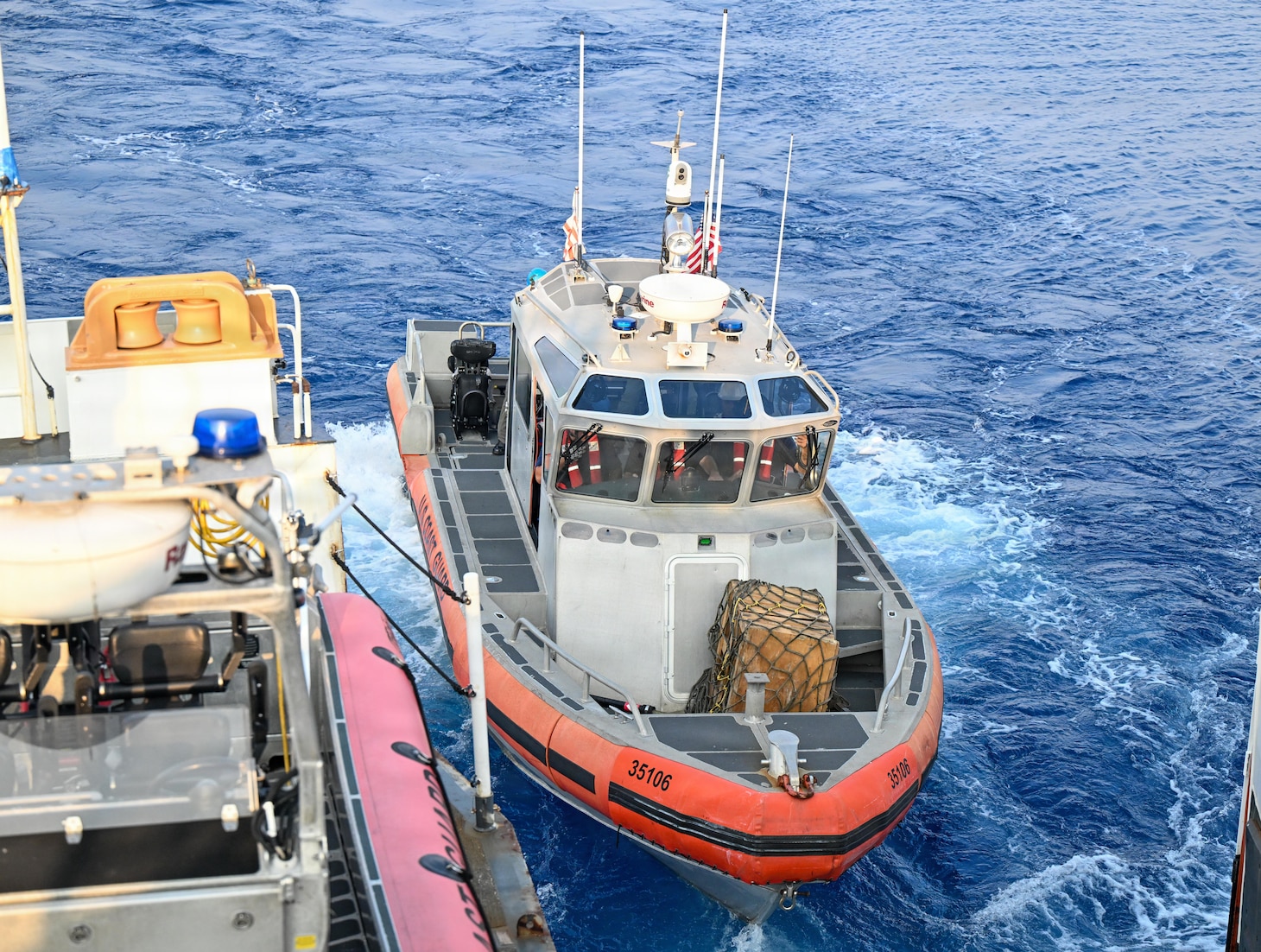 A U.S. Coast Guard 35-foot Long-Range Interceptor embarked cutter boat departs Legend-class cutter USCGC Midgett (WMSL 757) with members of the Philippine Navy after training with Midgett’s crew during the Maritime Cooperative Activity (MCA) in the Philippines’ Exclusive Economic Zone, May 28, 2026. The U.S Navy routinely operates with the Armed Forces of the Philippines and partners and allies through MCAs to continually develop, exercise and enhance multi-domain tactical interoperability to uphold peace and security in the region. Midgett is forward-deployed and assigned to Destroyer Squadron (DESRON) 15, the Navy’s largest DESRON and U.S. 7th Fleet’s principal surface force. U.S. 7th Fleet, the Navy’s largest forward-deployed numbered fleet, routinely interacts and operates with allies and partners in preserving a free and open Indo-Pacific.  (U.S. Coast Guard Photo by Petty Officer 3rd Class Austin Wiley)