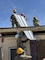 Army soldiers working on a roof.