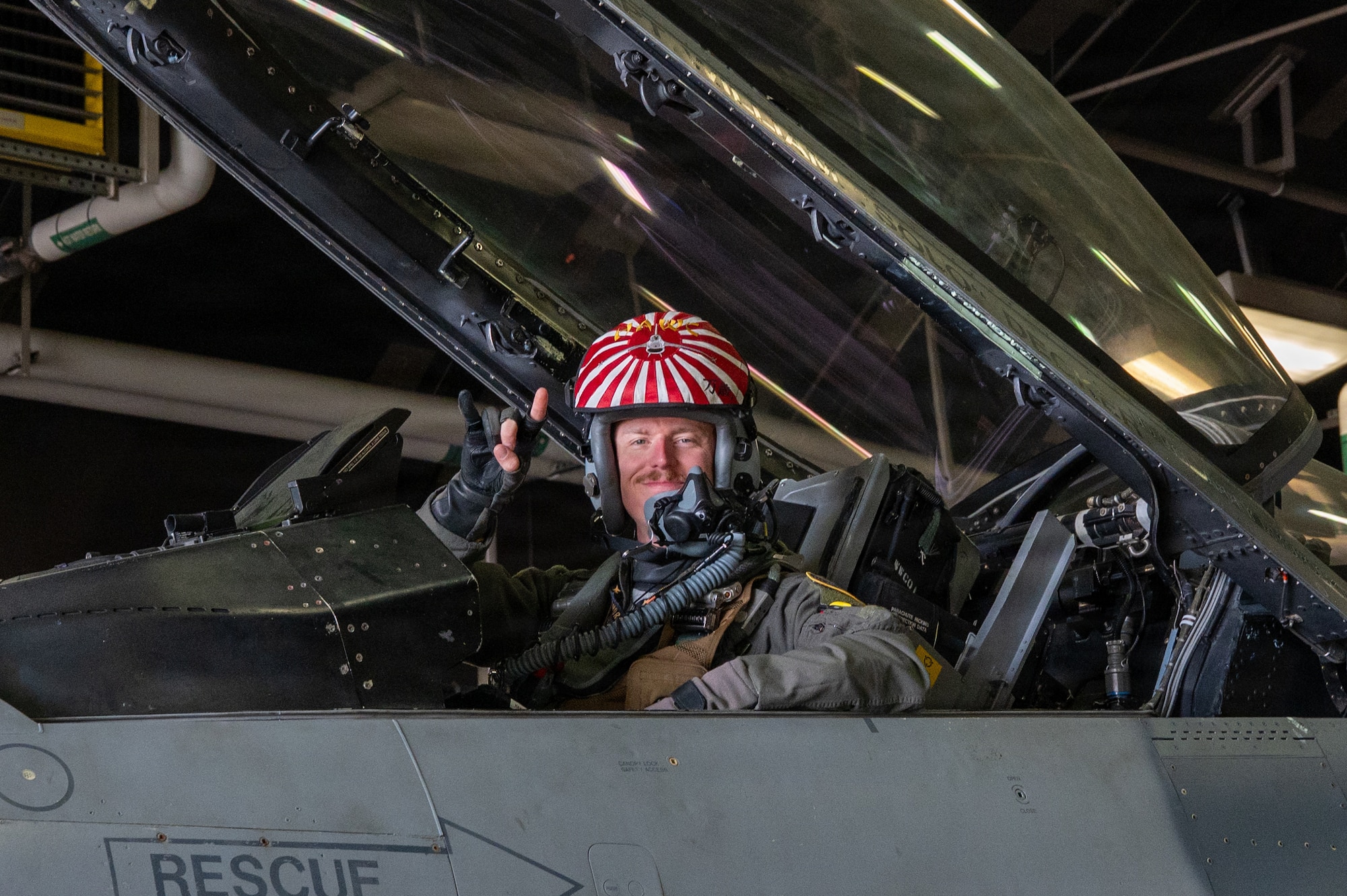 U.S. Air Force Capt. Kinser “Hawc” Newkirk, 14th Fighter Squadron F-16 Fighting Falcon pilot, poses for a photo from the cockpit of an F-16