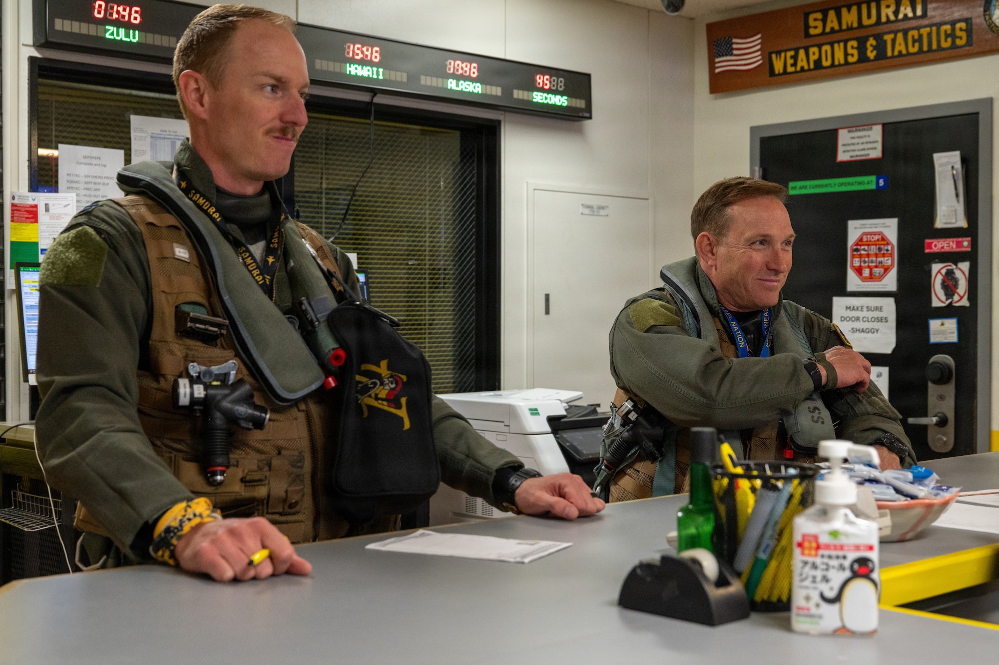 U.S. Air Force Col. Paul “Voodoo” Davidson, right, 35th Fighter Wing (FW) commander, and Capt. Kinser “Hawc” Newkirk, 14th Fighter Squadron F-16 Fighting Falcon pilot, receive a pre-flight briefing