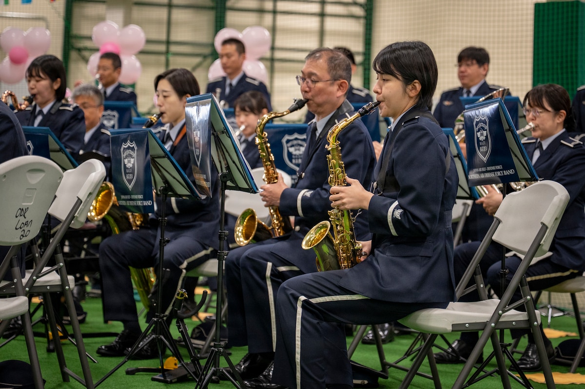 The Japan Air Self-Defense Force Northern Air Defense Band performs a song during the Sakura Olympics 2026 closing ceremony at Misawa Air Base, Japan, May 29, 2026. The annual event provided an opportunity for U.S. and Japanese personnel to come together, build camaraderie and celebrate their shared partnership. (U.S. Air Force photo by Senior Airman Brittany Russell)