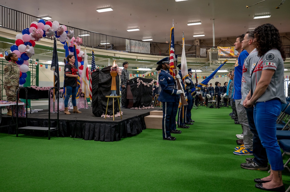 Participants stand for the singing of the national anthem during the Sakura Olympics 2026 closing ceremony at Misawa Air Base, Japan, May 29, 2026. The ceremony highlighted the unity and mutual respect fostered between allied partners throughout the competition. (U.S. Air Force photo by Senior Airman Brittany Russell)