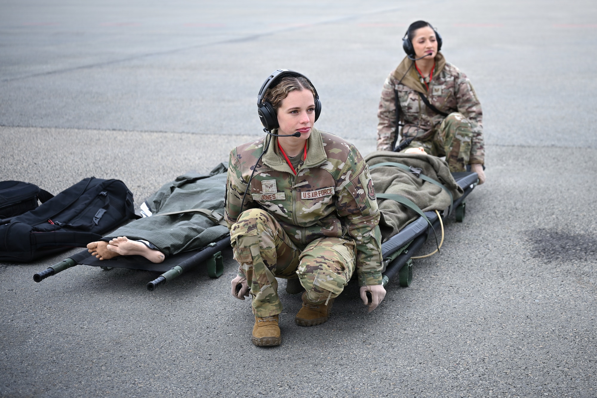 U.S. Air Force Senior Airman Rogan Jones, 86th Aeromedical Evacuation Squadron aeromedical evacuation technician, left, and U.S. Air Force Tech. Sgt. Diandra Velasquez, 86th Aeromedical Evacuation Squadron aeromedical evacuation technician, prepare to carry a litter onto an aircraft
