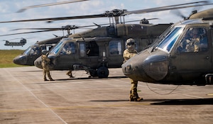 Multiple UH-60 Blackhawks and crew from 1-214th General Support Aviation Battalion, 12th Combat Aviation Brigade run engines and spin blades in preparation for a notional air assault on 26 August, 2026. The notional air assault involved multiple airframes, and provided invaluable training at every echelon. It was conducted as a part of a multinational U.S. Army-led exercise designed to test readiness, interoperability, and combat capabilities with NATO allies and partner nations.  (U.S. Army Photo by Cpl. Grant Hockley)