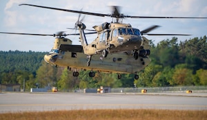 Multiple UH-60 Blackhawks and crew from 1-214th General Support Aviation Battalion, 12th Combat Aviation Brigade run engines and spin blades in preparation for a notional air assault on 26 August, 2026. The notional air assault involved multiple airframes, and provided invaluable training at every echelon. It was conducted as a part of a multinational U.S. Army-led exercise designed to test readiness, interoperability, and combat capabilities with NATO allies and partner nations.  (U.S. Army Photo by Cpl. Grant Hockley)