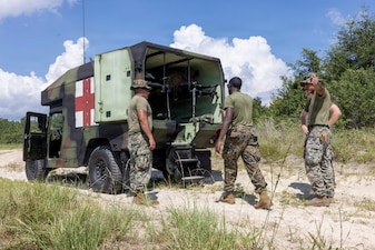 U.S. Marines and Sailors with 2nd Medical Battalion, 2nd Marine Logistics Group, prepare to unload simulated casualties from a M997 Humvee during a 2nd Medical Battalion certification exercise at Marine Corps Base Camp Lejeune, North Carolina, August 19, 2026. The certification exercise was conducted by 2nd Medical Battalion to ensure that 2nd MLG’s Marines and Sailors maintain the highest standard of combat readiness and medical capabilities. (U.S. Marine Corps photo by Lance Cpl. Isabella Ramos)