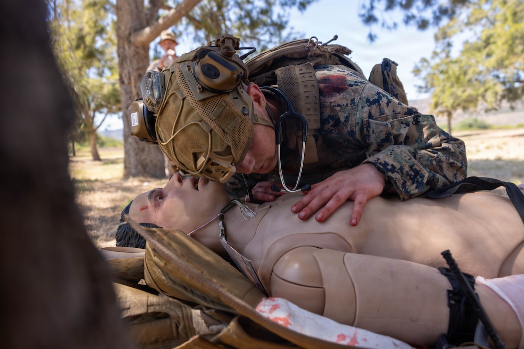 260825-M-BX248-2046 A U.S. Navy Corpsman with 4th Medical Battalion, 4th Marine Logistics Group, triages a simulated casualty during a prolonged casualty care exercise at Marine Corps Base Camp Pendleton, California, Aug. 25, 2026. Prolonged casualty care helps corpsman train for situations when getting a casualty to a higher echelon of care is not available. (U.S. Marine Corps photo by Lance Cpl. Ronnie Mejia)