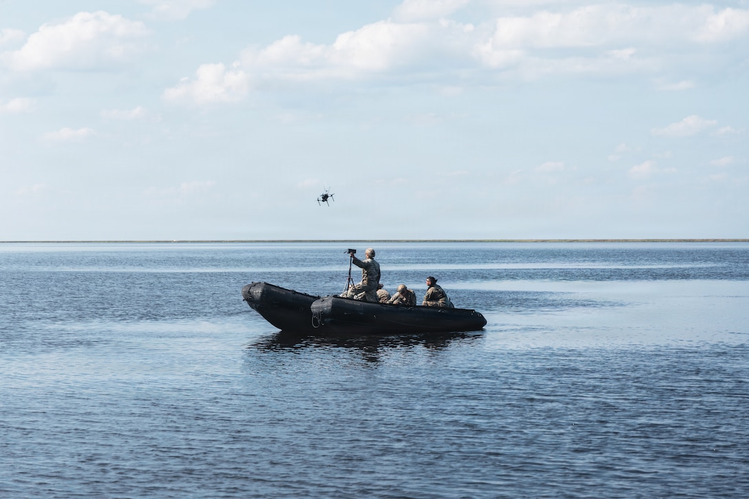 U.S. Marines with Maritime Raid Force, 26th Marine Expeditionary Unit, observe the launch of a Neros Archer first-person view drone during Command Post Exercise 2 at Bombing Target 11 on Piney Island, North Carolina, Aug. 25, 2026. Testing this cyber-secure FPV platform during the exercise allows the MEU to field rapid, squad-level kinetic strike capabilities on the modern battlefield. (U.S. Marine Corps photo by Cpl. Osmar VasquezHernandez)
