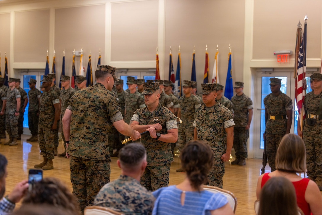 U.S. Marine Corps Col. Bobby W. Lee Jr., left, the commanding officer of 6th Marine Regiment, 2nd Marine Division, passes the noncommissioned officer sword to Sgt. Maj. Carl J. Jacobsen, the incoming command senior enlisted leader of 6th Marines, during a relief and appointment ceremony at the Marston Pavilion on Marine Corps Base Camp Lejeune, North Carolina, Aug. 28, 2026. The ceremony transferred the position of command senior enlisted leader from Sgt. Maj. Justin K. Bradley to Sgt. Maj. Carl J. Jacobsen. (U.S. Marine Corps photo by Lance Cpl. Preston Morris)