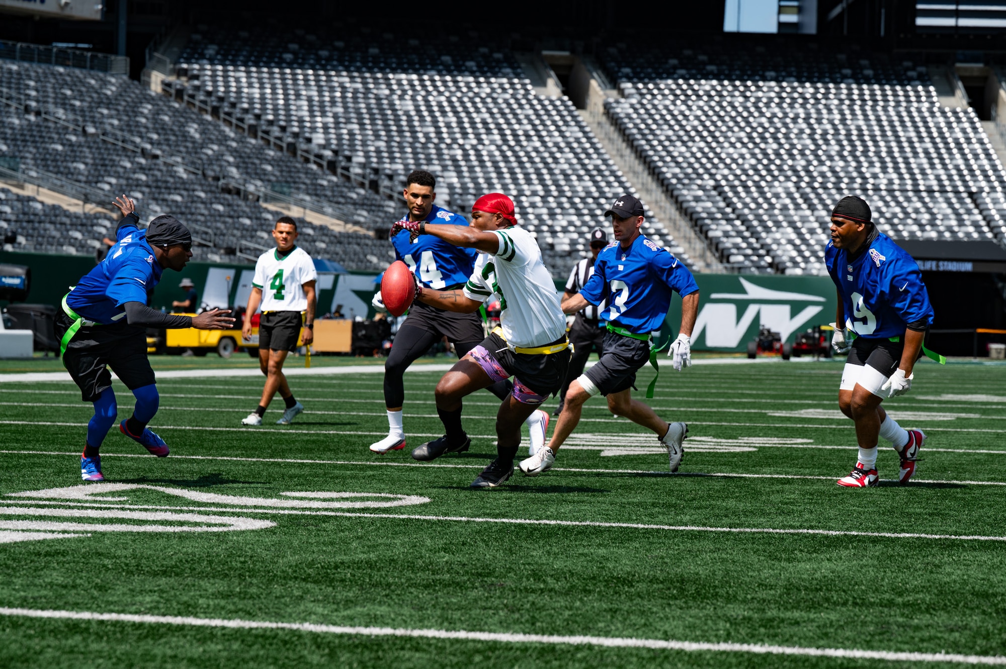 Service members assigned to Joint Base McGuire-Dix-Lakehurst and Fort Hamilton, N.Y., participate in a flag football game at MetLife Stadium, N.J., Aug. 28, 2026. JB MDL prevailed over Fort Hamilton with a final score of 28-21. (U.S. Air Force photo by Airman 1st Class Haeleigh Bayle)