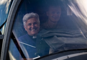Diane Grano, reverend at St. Christopher's Church, smiles while sitting in a CV-22 Osprey during Clergy Day at RAF Mildenhall, England, Aug. 20, 2026.