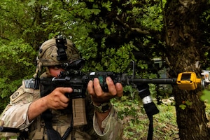 A U.S. Soldier assigned to the 173rd Mobile Brigade Combat Team, provides security during Saber Junction 26-11 at the Hohenfels Training Area, Joint Multinational Readiness Center (JMRC), Germany, Aug. 28, 2026. 7th Army Training Command provides a unique environment in Europe to develop leaders and formations who are prepared for large-scale combat operations, improving readiness. (U.S. Army Photo by SPC. Kaleb Lampkin)