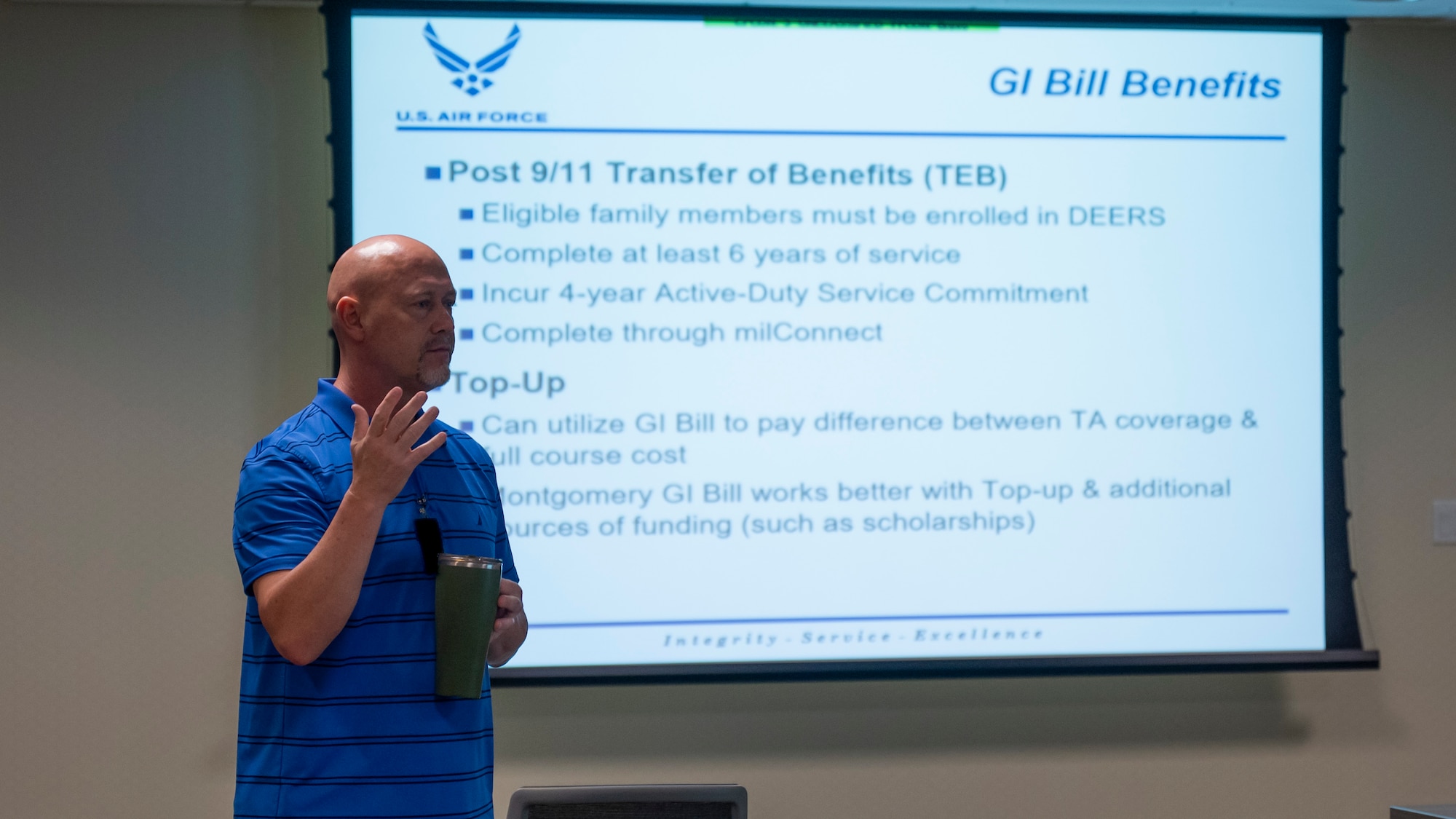 Christopher Lawson gives a brief on GI Bill benefits during an education fair.