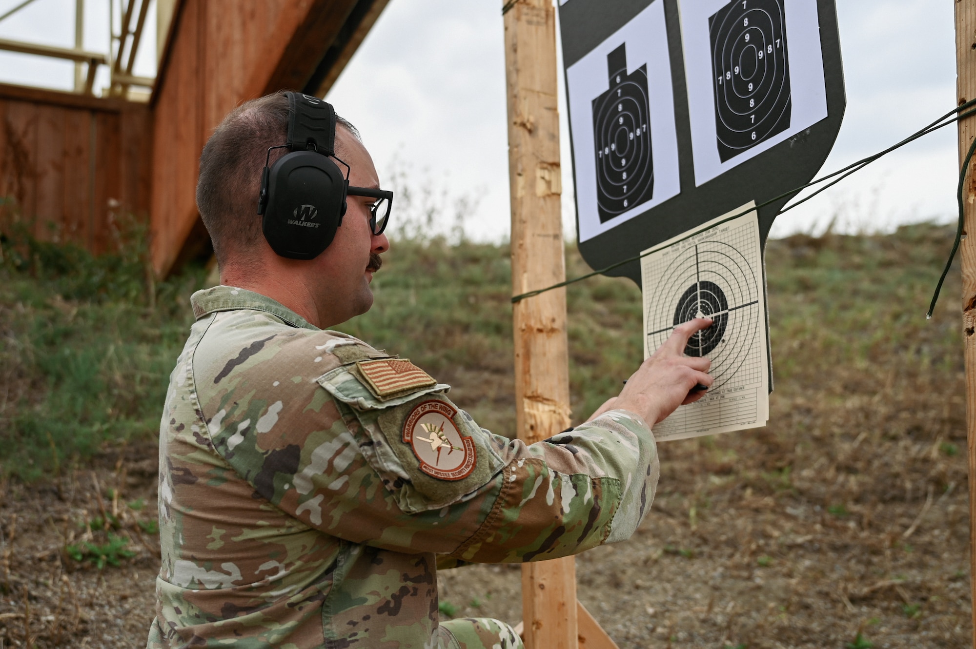A U.S. Air Force service member reviews his targets.