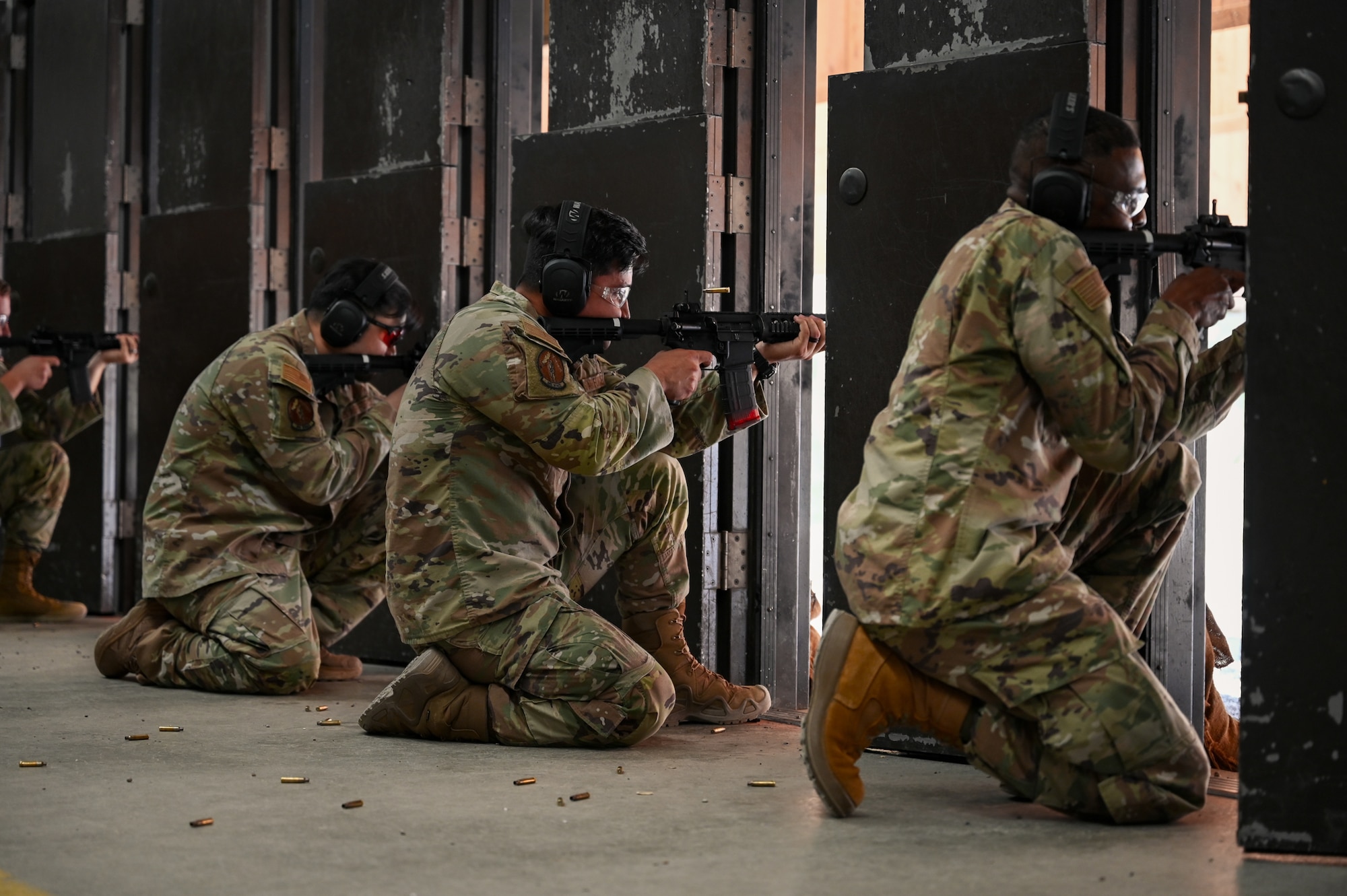 U.S. Air Force personnel fire M4 carbines.