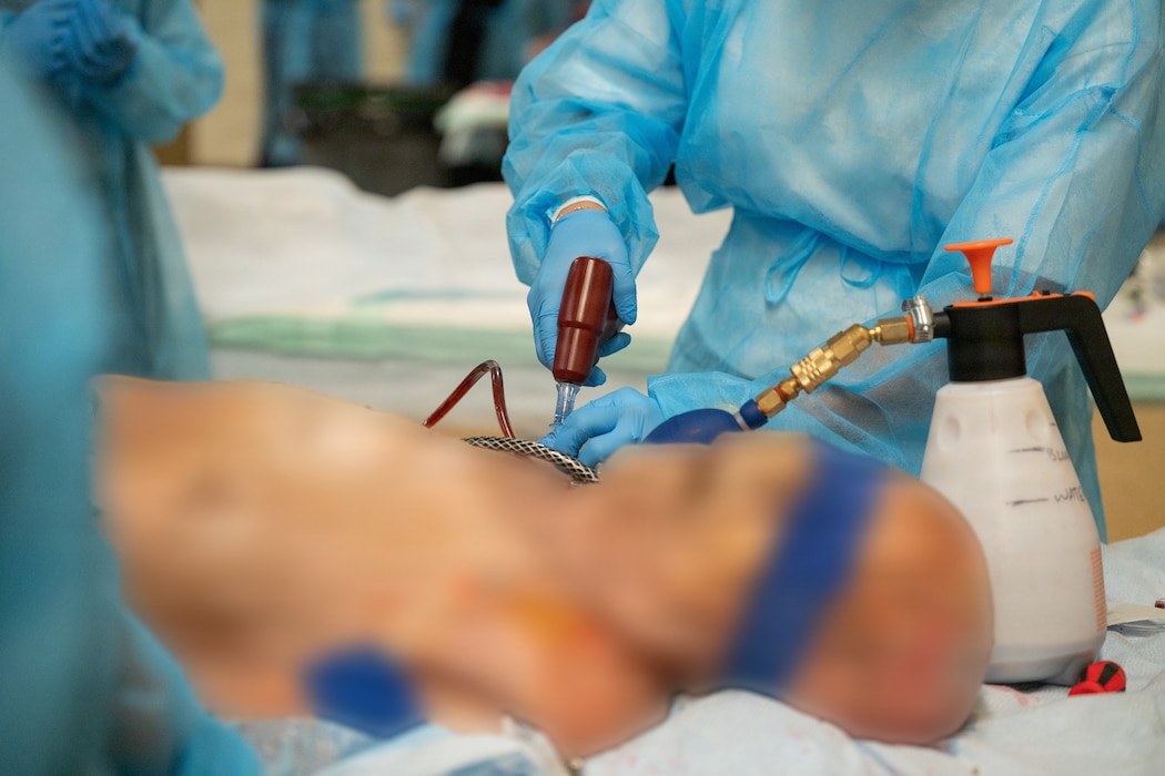 A U.S. service member practices establishing intraosseous access during an advanced medical training cadaver lab at Marine Corps Base Hawaii, Aug. 25, 2026.