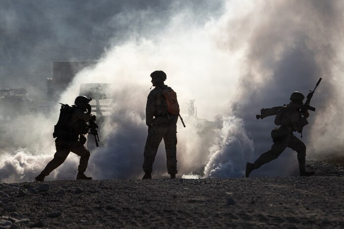 U.S. Marines with Echo Company, 2nd Battalion, 1st Marine Regiment, 1st Marine Division, maneuver to a building during a platoon-level urban assault as part of Service Level Training 4-26 at Marine Corps Air-Ground Combat Center Twentynine Palms, California, Aug. 30, 2026. SLTE is designed to be a challenging, realistic training exercise that produces combat-ready forces capable of operating as an integrated Marine Air-Ground Task Force across all domains of military operations. (U.S. Marine Corps photo by Lance Cpl. Journey Fisher)