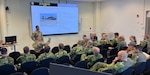 Army Lt. Col. Eric Fritz, the commander of the New York Army National Guard’s 3rd Battalion, 142nd Assault Helicopter Battalion, conducts one of a series of classes on Army air assault doctrine conducted for Swedish Air Force aviators at Malmen Air Base outside of Linkoping, Sweden, Aug. 26, 2026. Fritz and three other New York Army National Guard aviators spent two days training their Swedish counterparts in air assault techniques as part of the Department of War National Guard Bureau State Partnership Program relationship between the Swedish military and New York National Guard. Photo by Chief Warrant Officer 4 John Hermanson.
