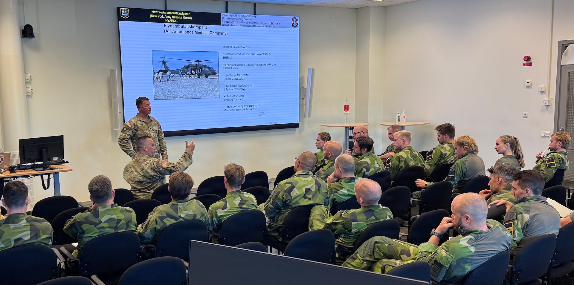 Army Lt. Col. Eric Fritz, the commander of the New York Army National Guard’s 3rd Battalion, 142nd Assault Helicopter Battalion, conducts one of a series of classes on Army air assault doctrine conducted for Swedish Air Force aviators at Malmen Air Base outside of Linkoping, Sweden, Aug. 26, 2026.