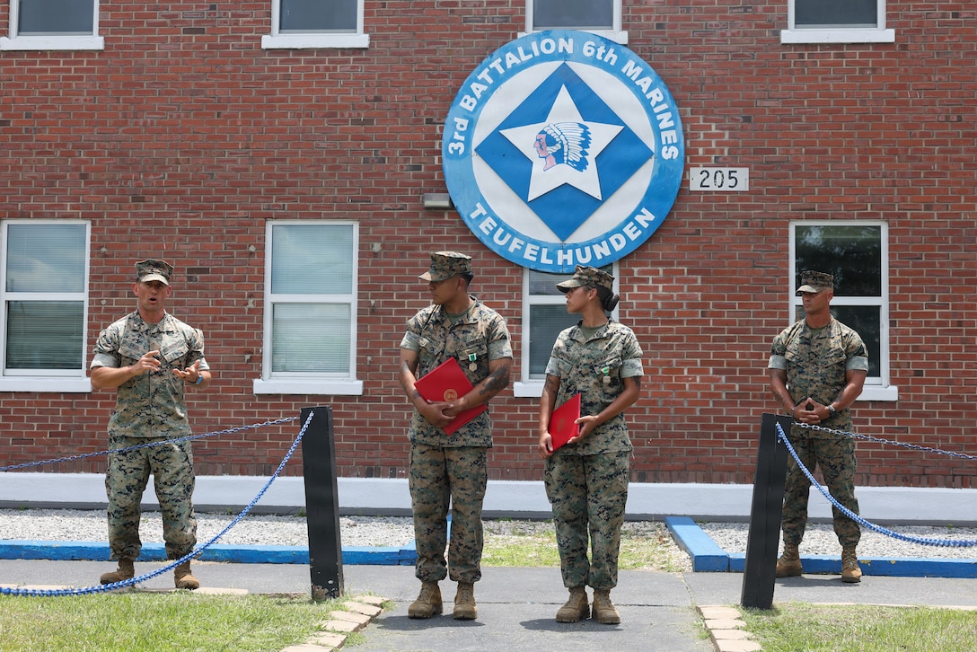 U.S. Marine Corps Lt. Col. Mark Paige, left, commanding officer of 3rd Battalion, 6th Marine Regiment, 2nd Marine Division, speaks during an award ceremony on Marine Corps Base Camp Lejeune, June 25, 2026.