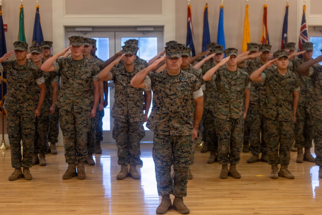 U.S. Marines with 1st Battalion, 8th Marine Regiment, 2nd Marine Division, render a salute during a relief and appointment ceremony at the Marston Pavilion on Marine Corps Base Camp Lejeune, North Carolina, Aug. 28, 2026.
