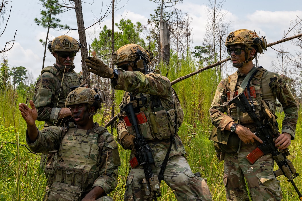 Airmen pointing.
