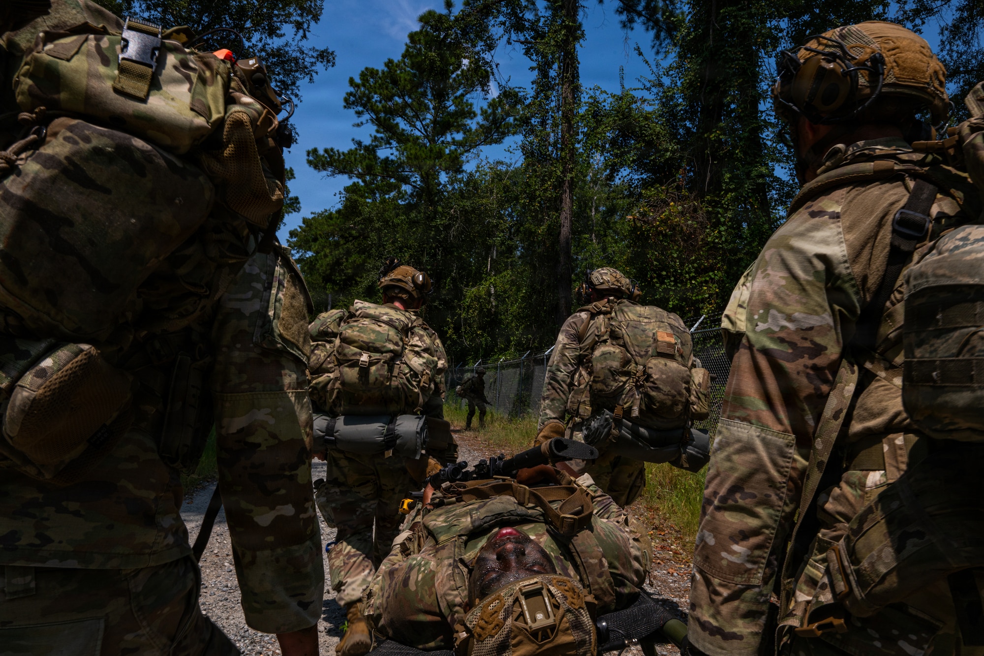 Airman being carried.