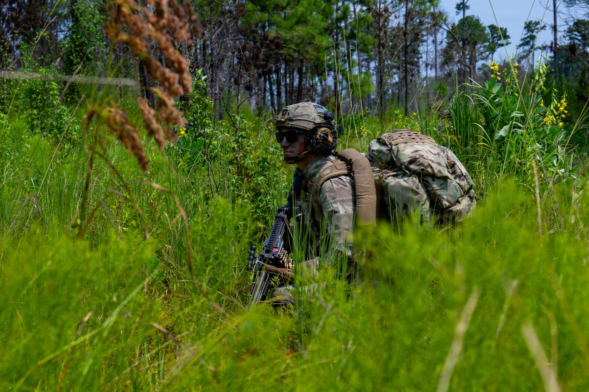 Airman kneeling.