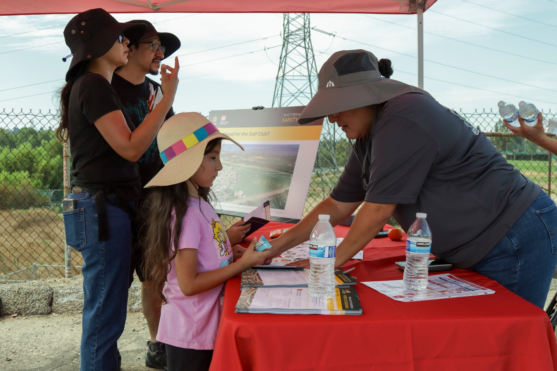 A participating family attends the Aug. 29 Whittier Narrows Walk the Dam event held by the U.S. Army Corps of Engineers in Pico Rivera, California. Participants were offered water, snacks and resources on the Whittier Narrows Dam advising of upcoming construction impacts as well as other information on the dam.
