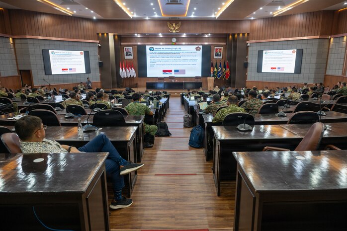 Multinational service members receive a scenario briefing during the first day of a staff exercise during Super Garuda Shield 26 held at the Indonesian Armed Forces Staff and Command School in Bandung, Indonesia, Aug. 31, 2026.