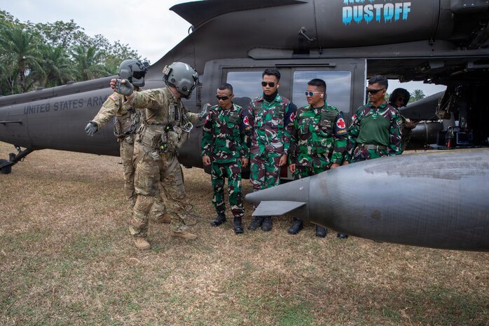U.S. Army Sgt. 1st Class Ezekiel Mendoza, assigned to the 1-52nd General Support Aviation Battalion, 11th Arctic Aviation Command, 11th Airborne Division, instructs Indonesian Soldiers during cold and hot load medical evacuation training as part of Super Garuda Shield 26 at Baturaja Combat Training Center, Indonesia, Aug. 31, 2026.