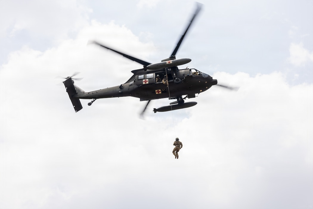 Indonesia (Aug. 31, 2026) — U.S. Army Sgt. 1st Class Ezekiel Mendoza, assigned to the 1-52nd General Support Aviation Battalion,11th Arctic Aviation Command, 11th Airborne Division, is hoisted onto a UH-60 Black Hawk during cold and hot load medical evacuation training as part of Super Garuda Shield 26 at Baturaja Combat Training Center, Indonesia, Aug. 31, 2026.