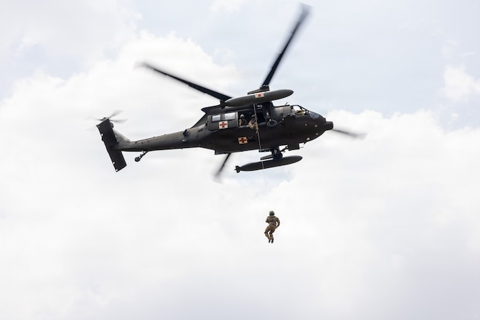 Indonesia (Aug. 31, 2026) — U.S. Army Sgt. 1st Class Ezekiel Mendoza, assigned to the 1-52nd General Support Aviation Battalion,11th Arctic Aviation Command, 11th Airborne Division, is hoisted onto a UH-60 Black Hawk during cold and hot load medical evacuation training as part of Super Garuda Shield 26 at Baturaja Combat Training Center, Indonesia, Aug. 31, 2026.