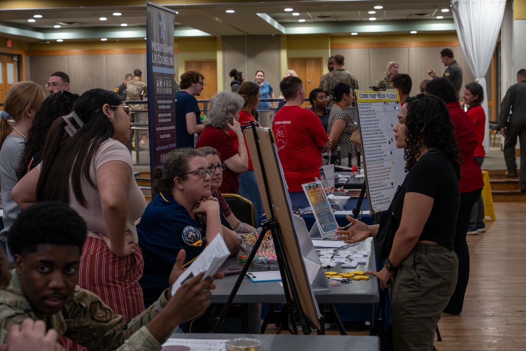 A member of Team Osan visits a booth during a helping agency resources fair.