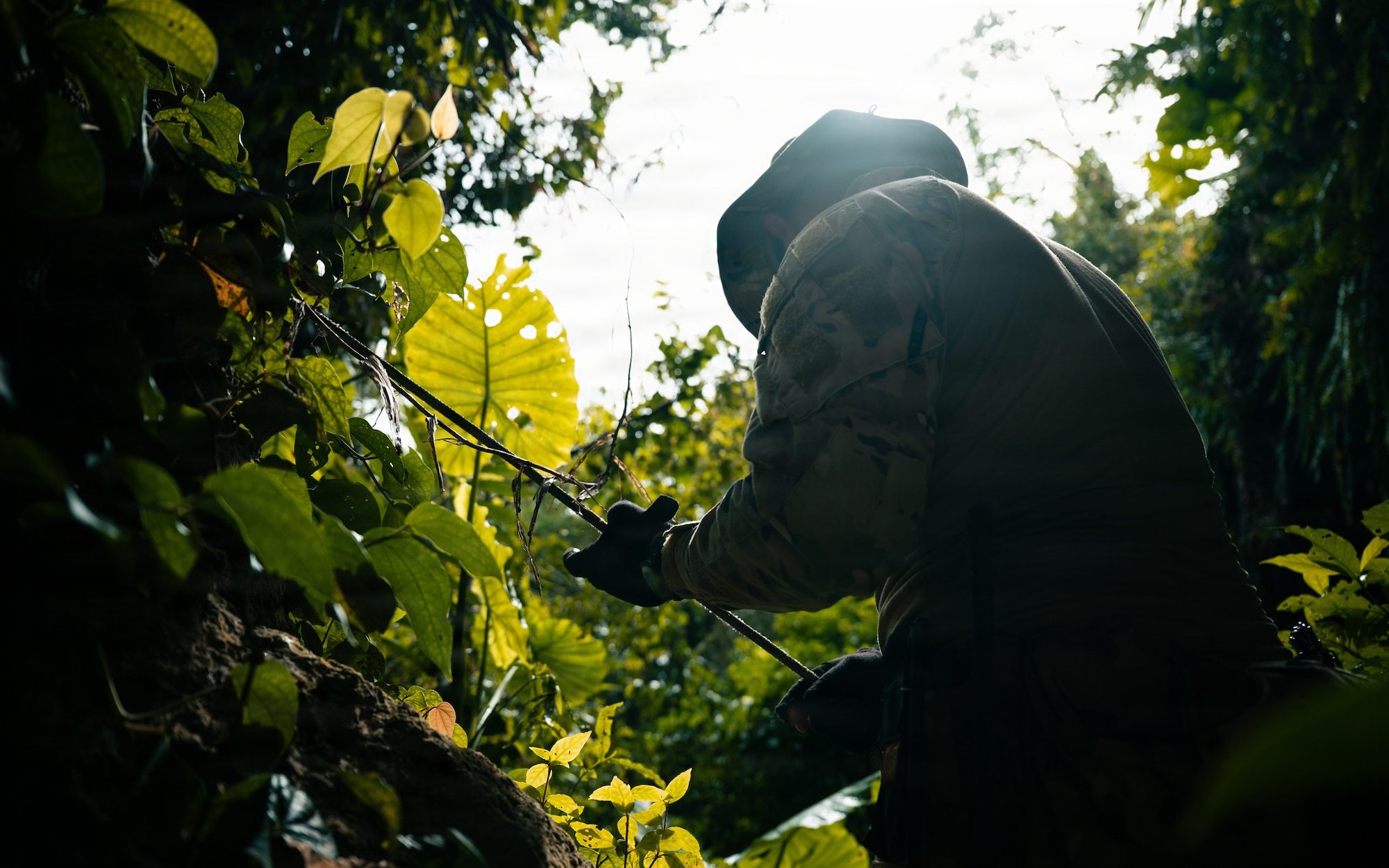 A technician searches for simulated unexploded ordnance.