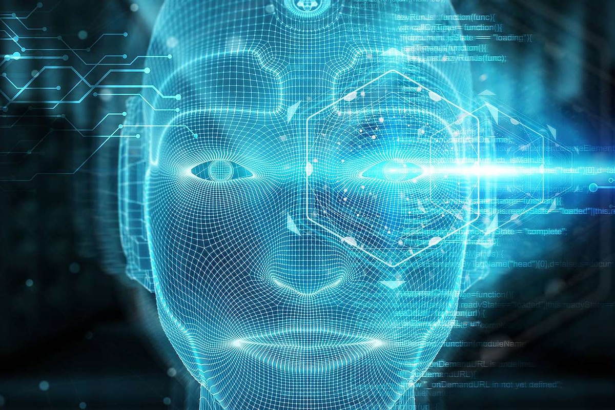 A human-like face is rendered in glowing blue grid lines on a computer screen.