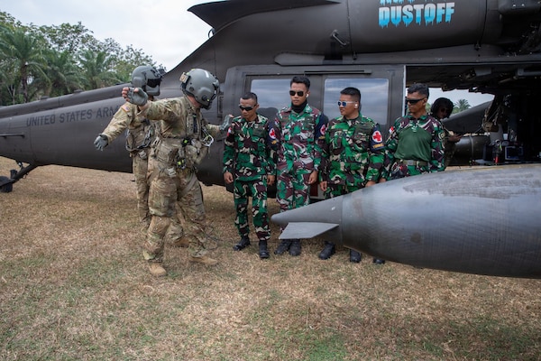 U.S. Army Sgt. 1st Class Ezekiel Mendoza, assigned to the 1-52nd General Support Aviation Battalion, 11th Arctic Aviation Command, 11th Airborne Division, instructs Indonesian Soldiers during cold and hot load medical evacuation training as part of Super Garuda Shield 26 at Baturaja Combat Training Center, Indonesia, Aug. 31, 2026.