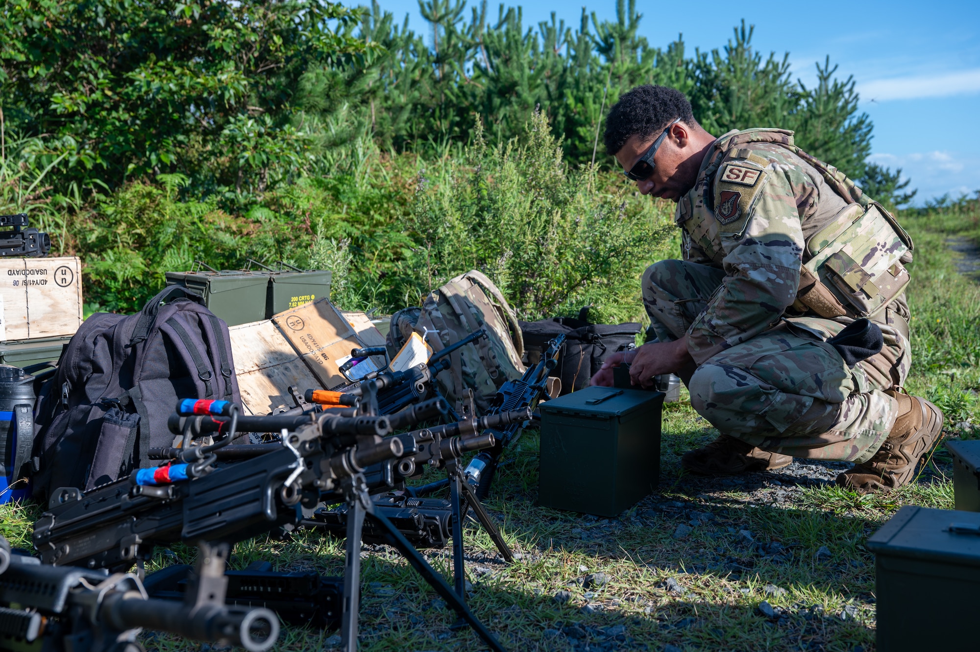 U.S. Air Force Airman 1st Class Justice Jett, 35th Security Forces Squadron (SFS) response force member, prepares equipment for heavy weapons training at Misawa Air Base, Japan, Aug. 28, 2026. The training reinforces weapons proficiency and combat readiness, preparing 35th SFS Airmen to defend the installation and sustain 35th Fighter Wing operations in support of U.S. and allied mission requirements across the Pacific. (U.S. Air Force photo by Airman 1st Class Angelica Winther)